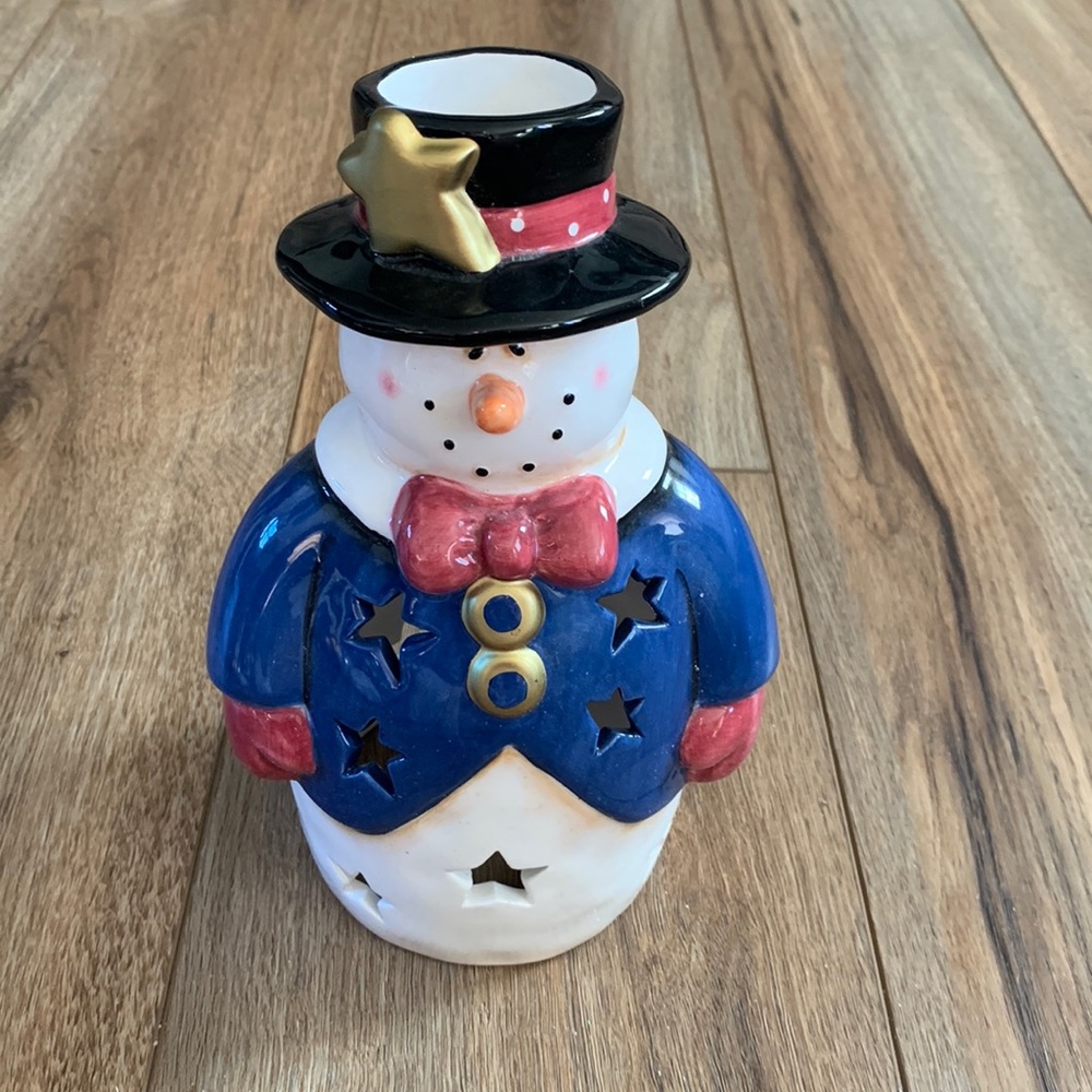 Snowman decor used as Christmas tree topper but think you can put light inside